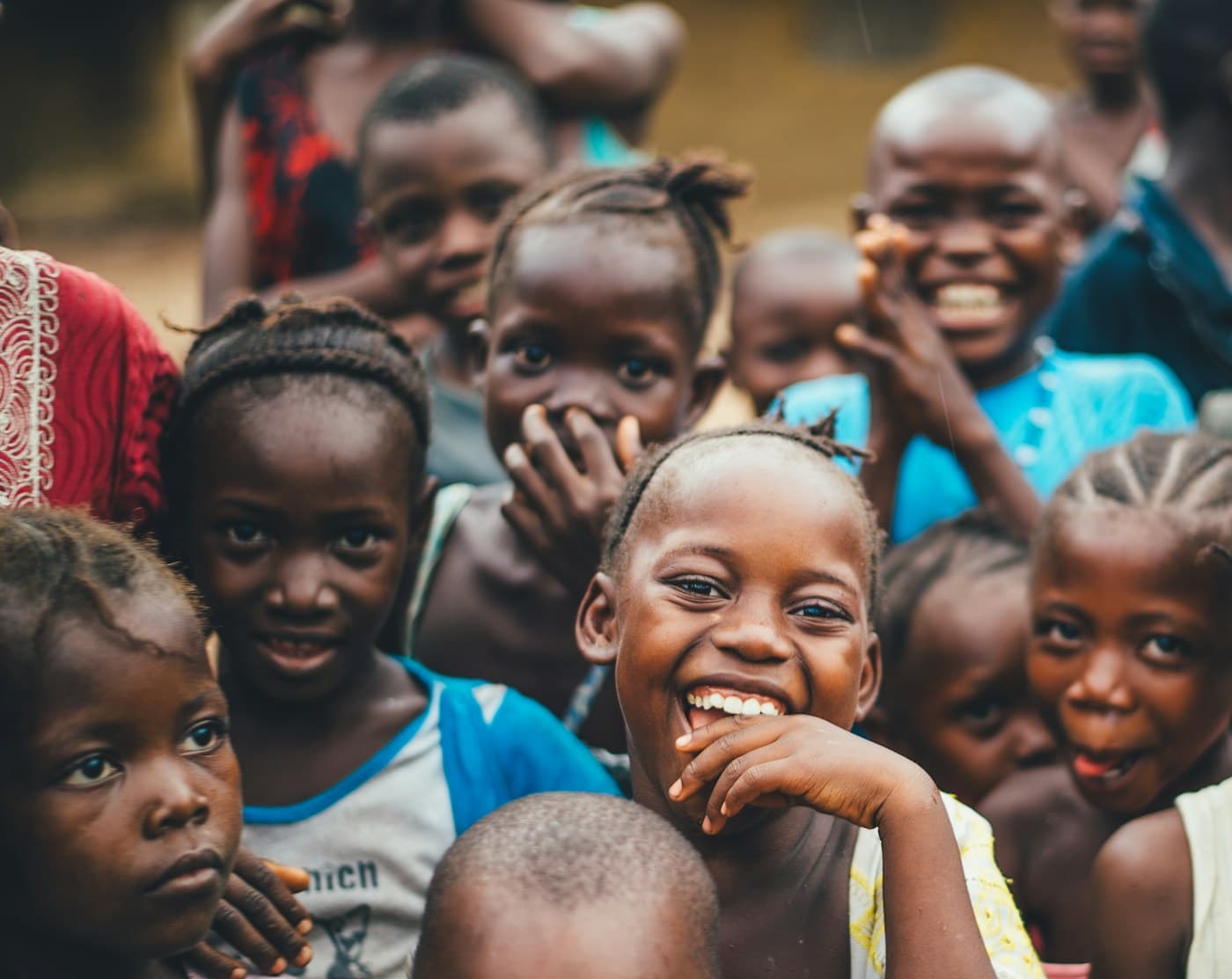 A group of smiling children gathered together
